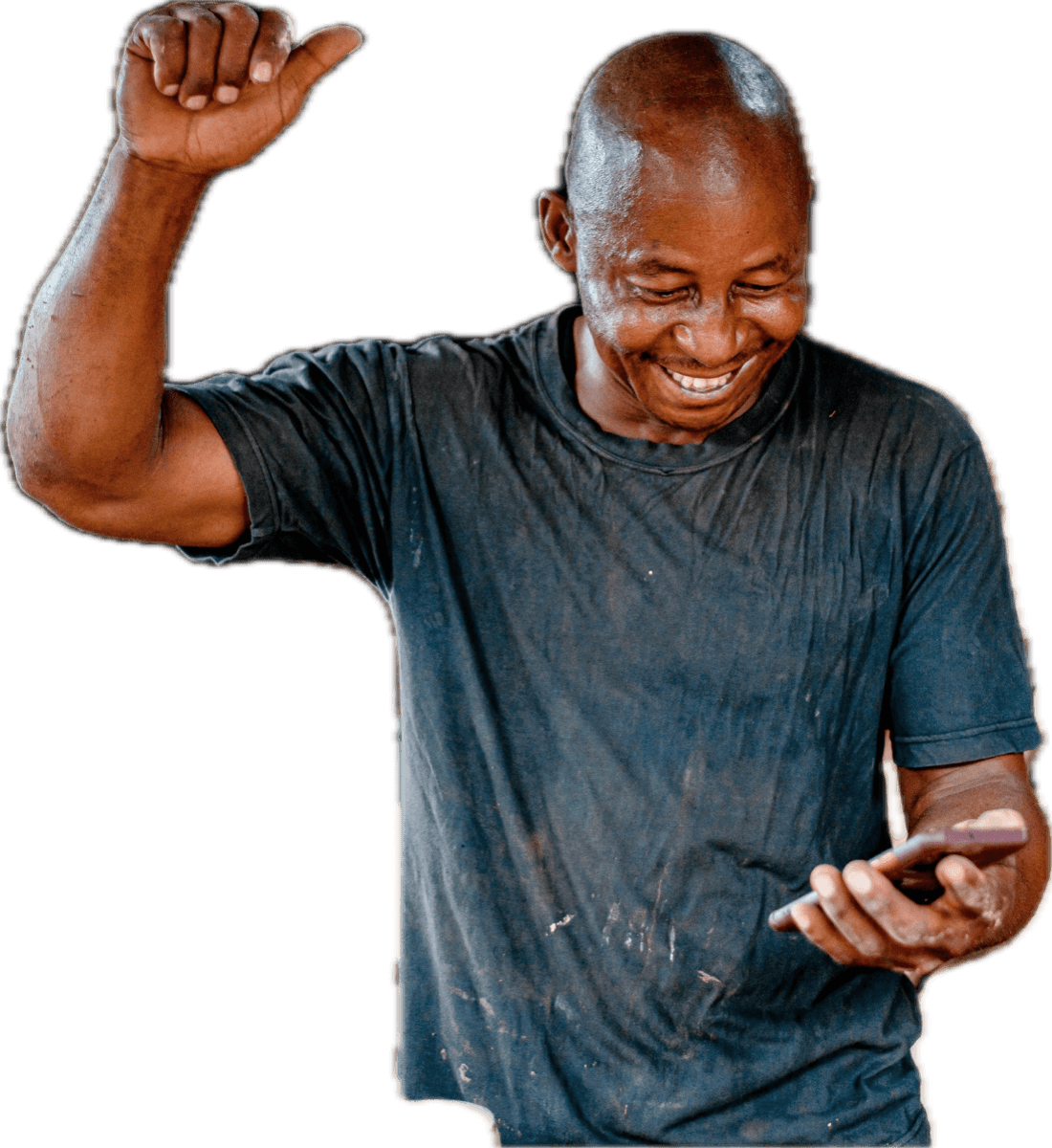 A contractor laughing at his phone, his fist in the air.