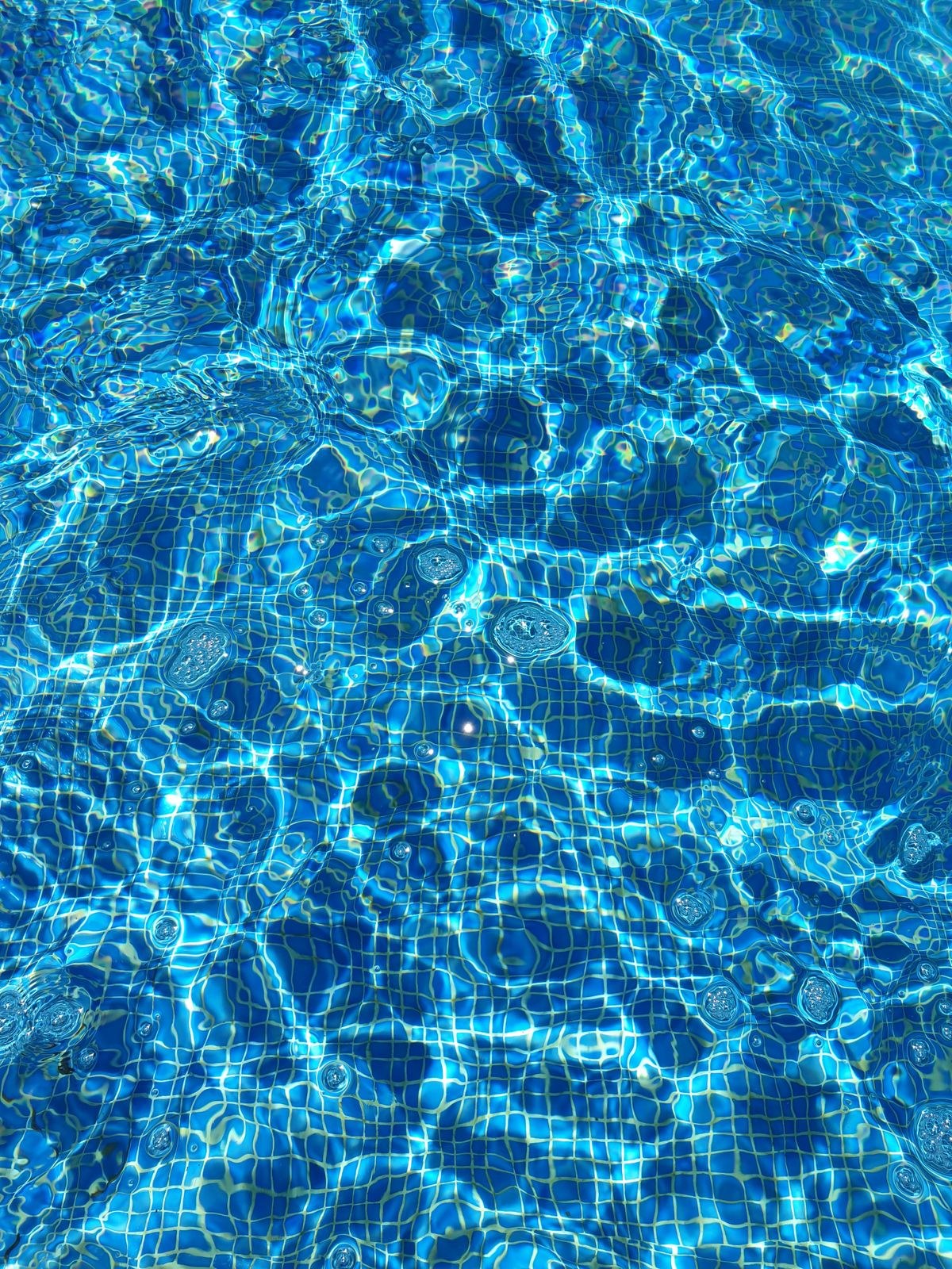 Sunlight on the surface of a swimming pool.