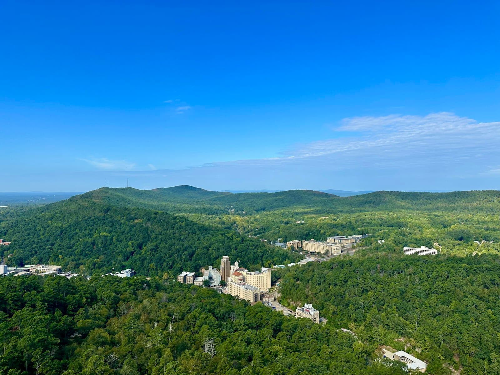 Hot Springs, Arkansas, among green forested hills.