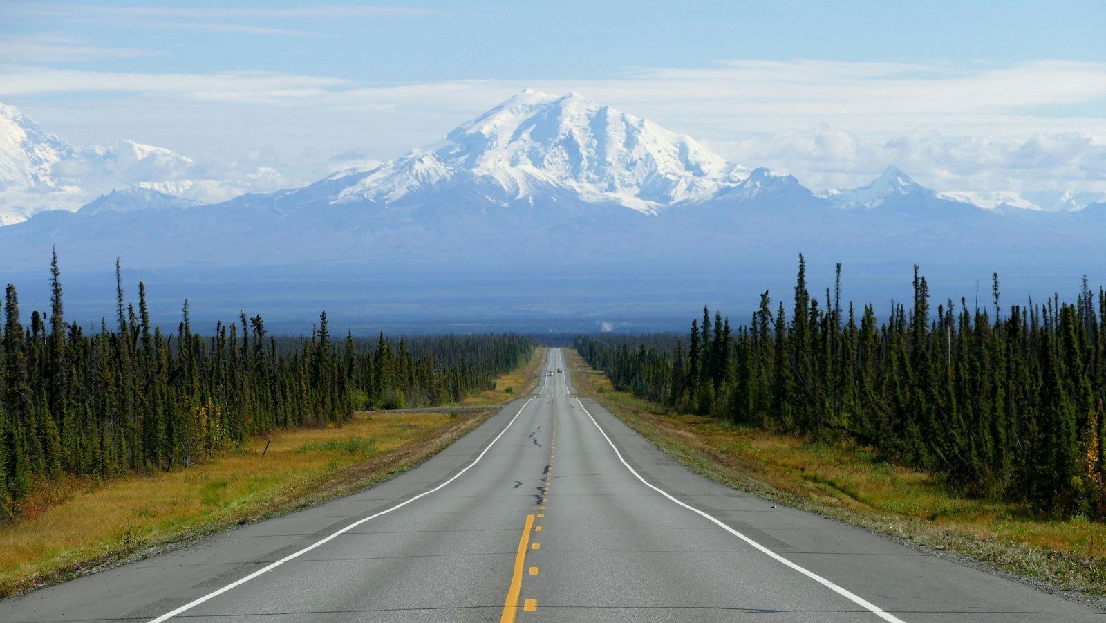 A highway running toward Mount Drum in Alaska.