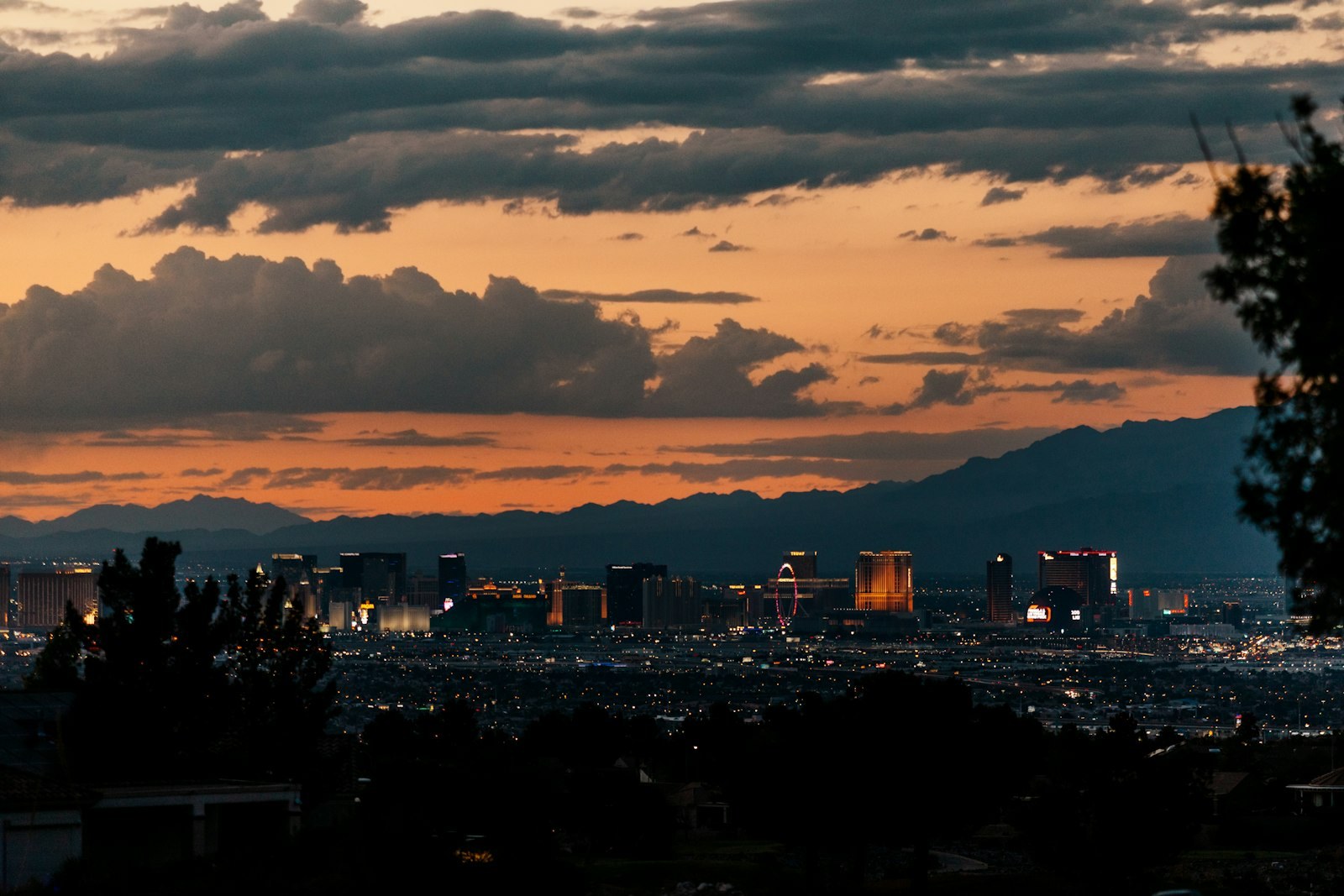 The Las Vegas Strip skyline at sunset, with mountains behind it.