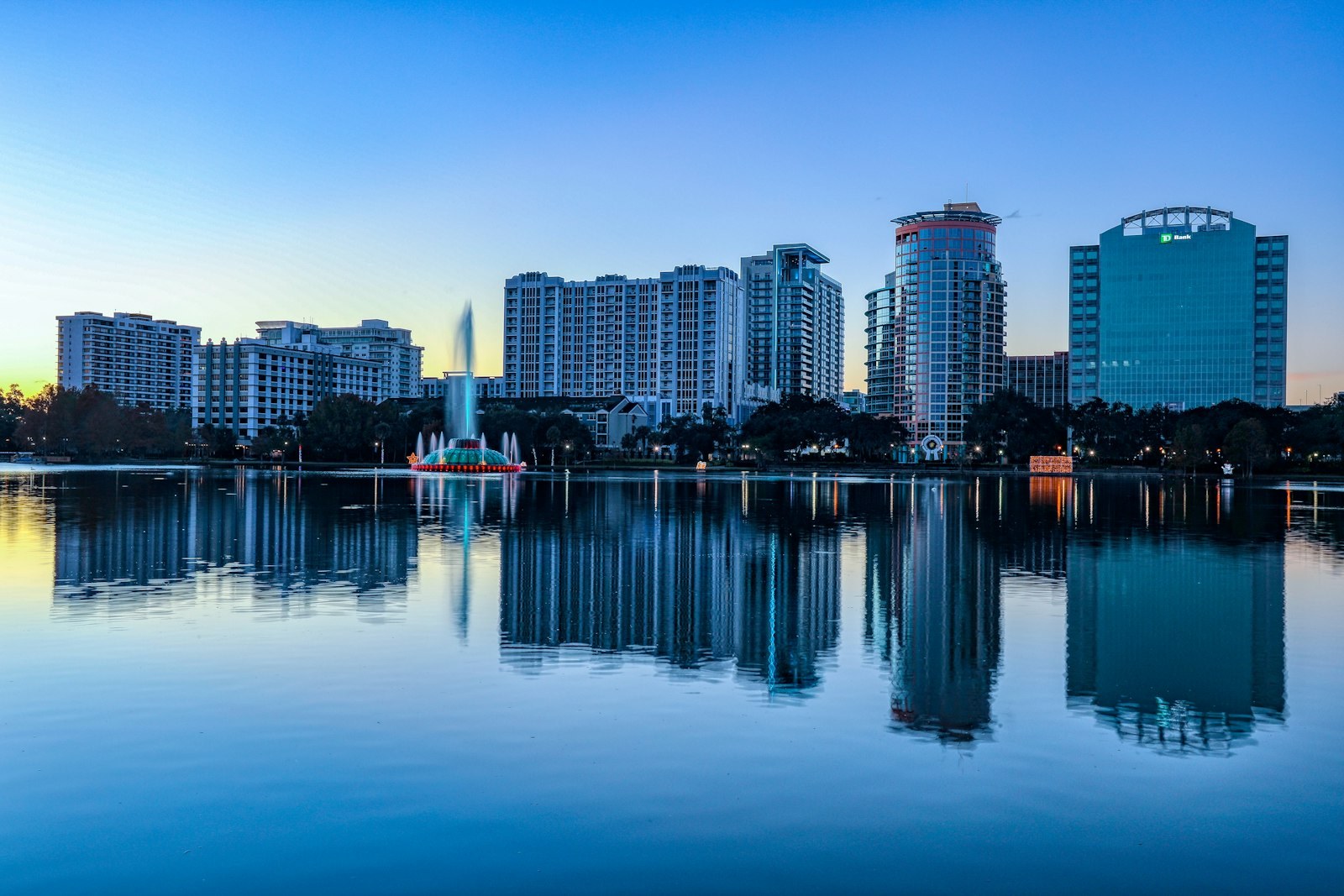 Downtown Orlando reflected in Lake Eola at dusk.