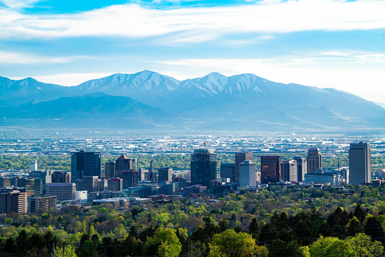 Downtown Salt Lake City with mountains behind it.