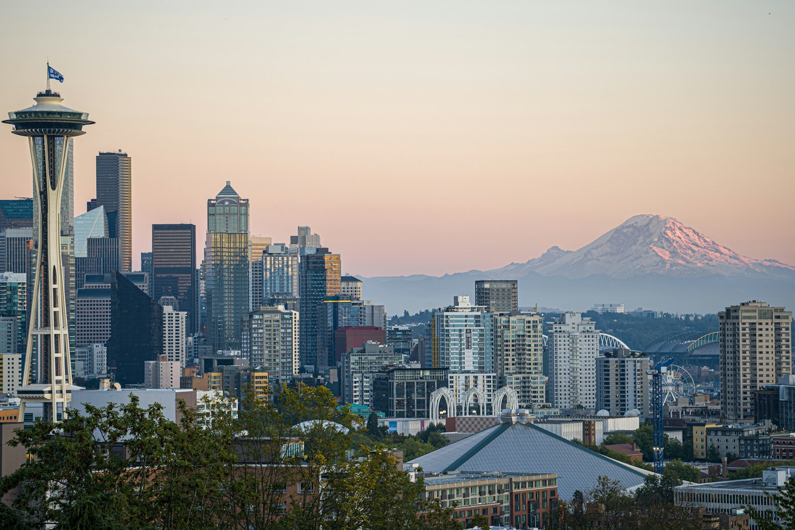 The Space Needle and the Seattle skyline with Mount Rainier beyond.